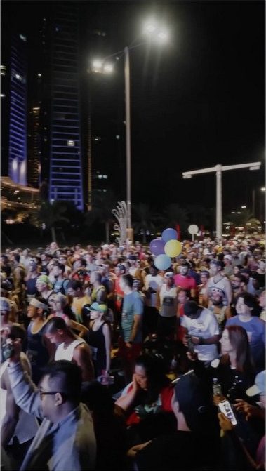 Runners gathered at night at the ADNOC Abu Dhabi Marathon start